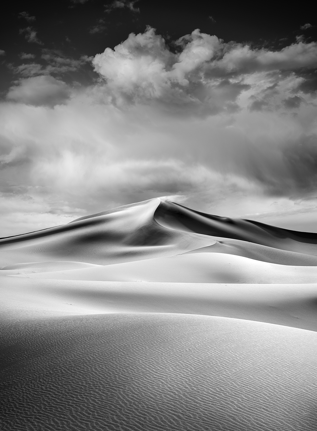Black and white fine art photograph of sand dunes in Death Valley National Park.