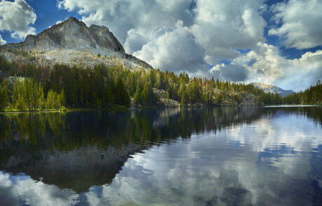 A beautiful photograph of a mountain lake overlooking Mammoth Mountain.