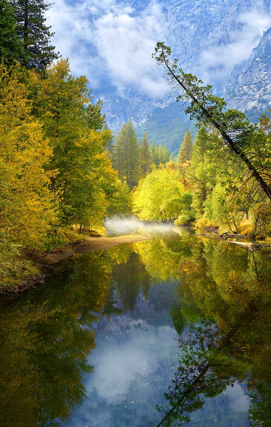 A calming scene of the Merced river in Yosemite national park during Autumn.