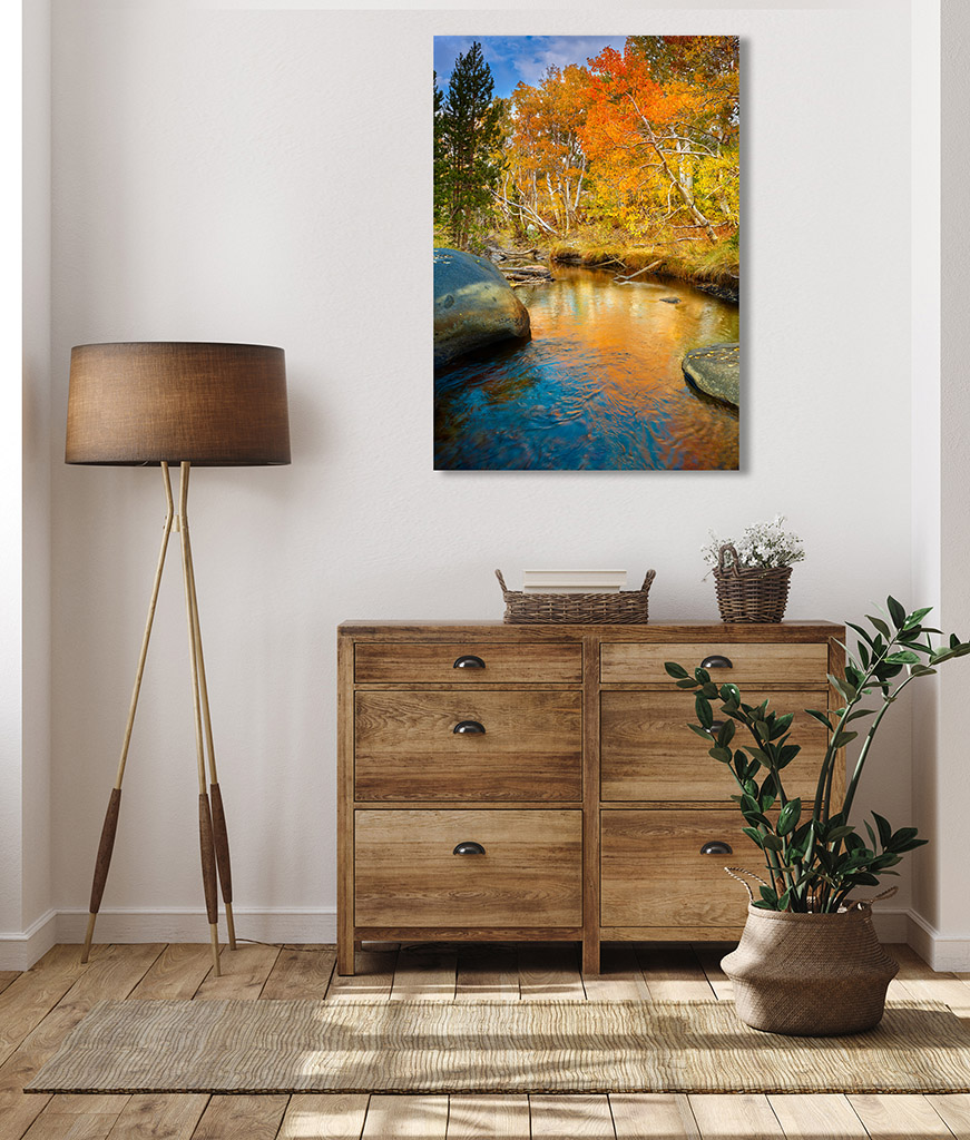 Fine art photograph of a serene creek reflecting the brilliant yellows and oranges of the aspen trees lining its banks