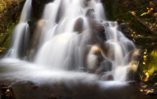 Fine art photograph of a waterfall in autumn.